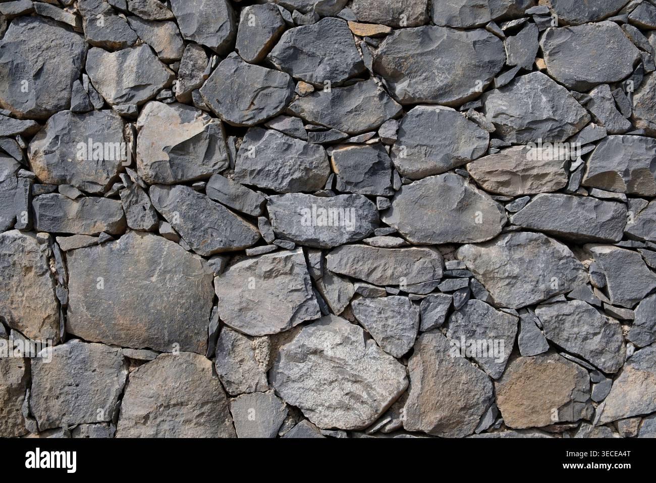 Foto astratta di un muro di pietra secca Foto Stock