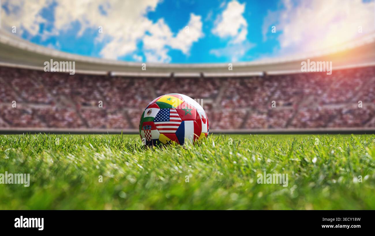 un pallone da calcio con varie bandiere nazionali sullo stadio. Concetto di competizione internazionale di calcio. Foto Stock