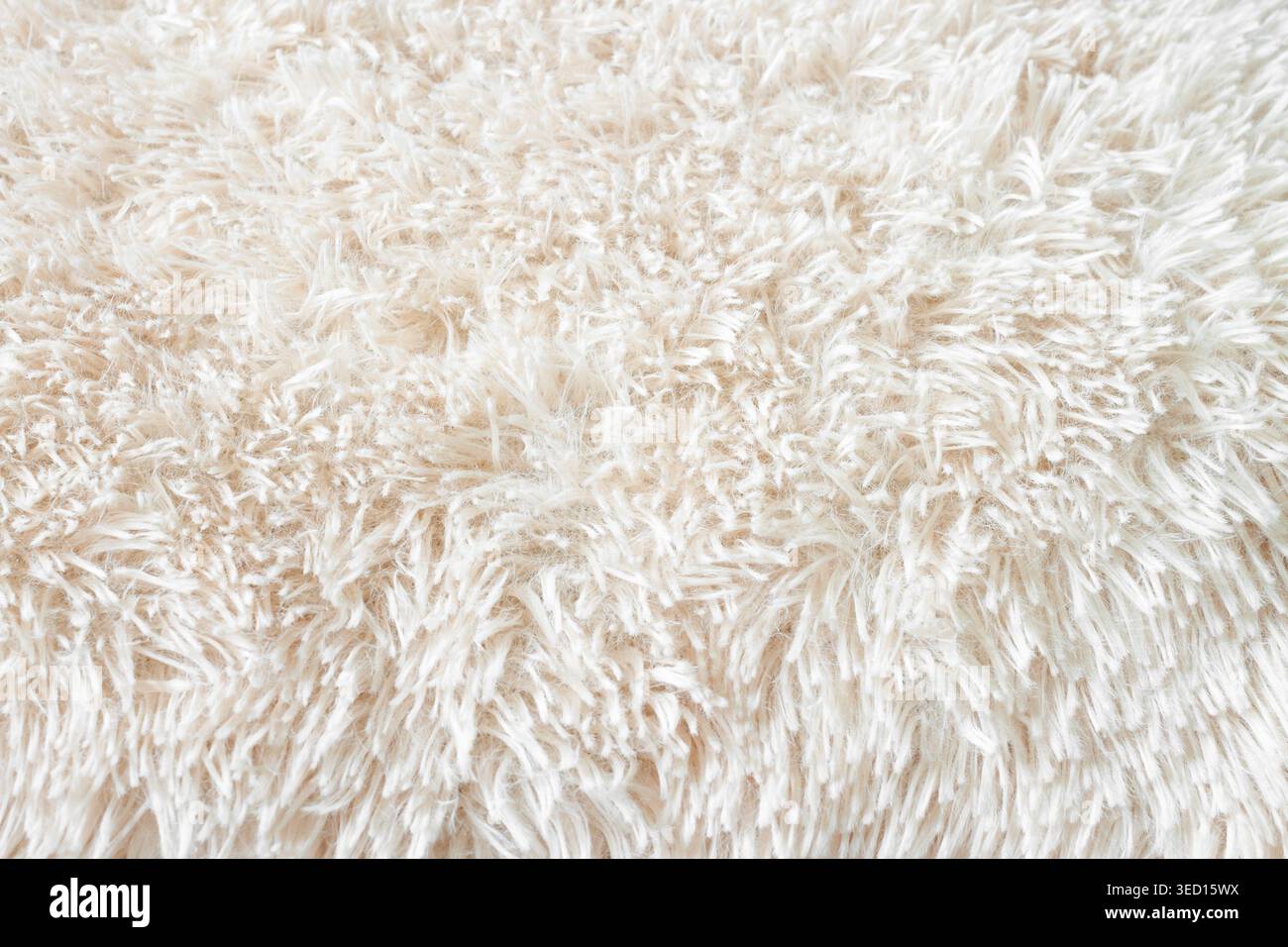 Soffice moquette beige chiaro in morbido pelo lungo sopra la vista macro Foto Stock