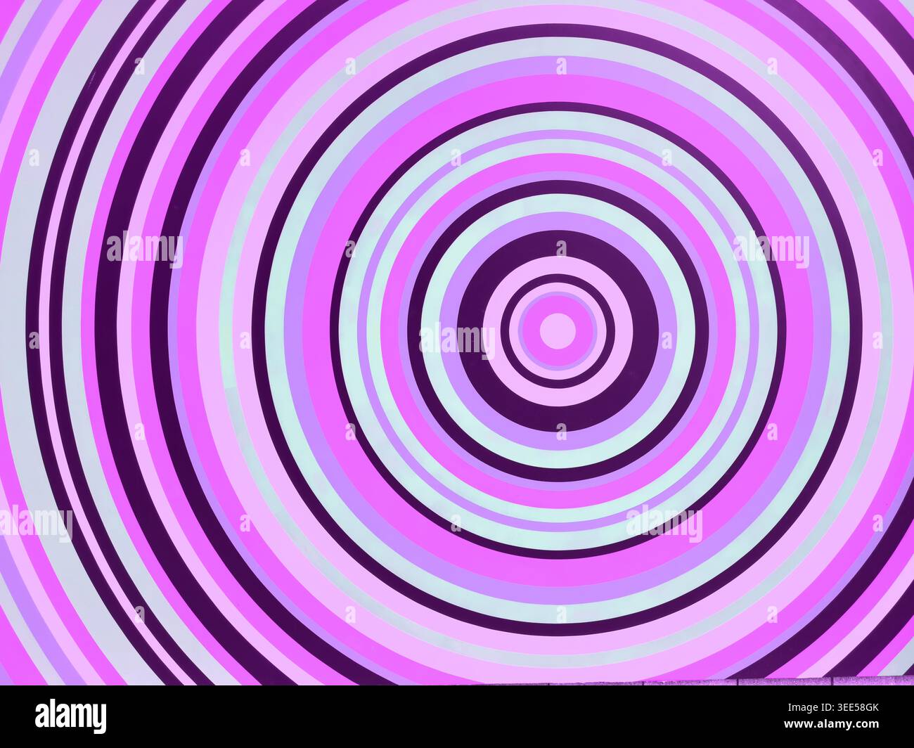 Una vista di cerchi a strisce colorate al neon, come sfondo. Foto Stock