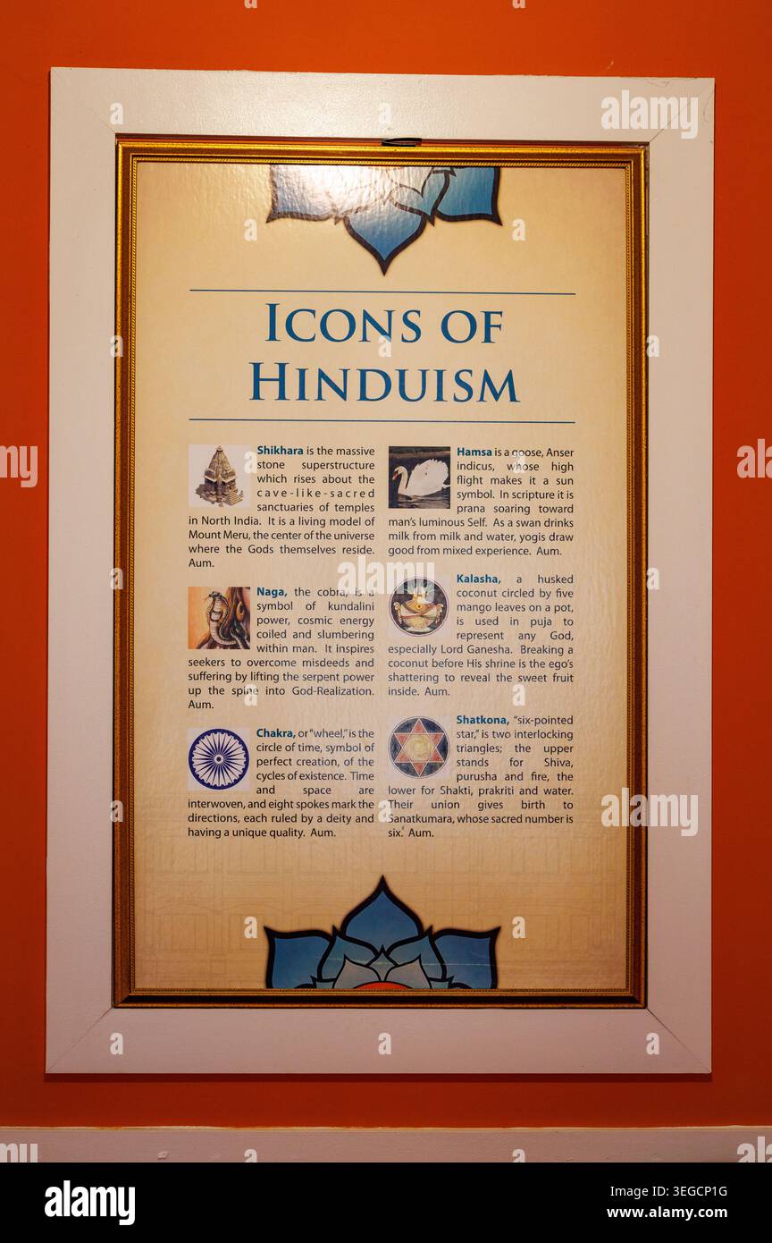 Hindu Heritage Centre, incorniciato "Icons of Hinduism" poster educativo su Orange Wall Foto Stock
