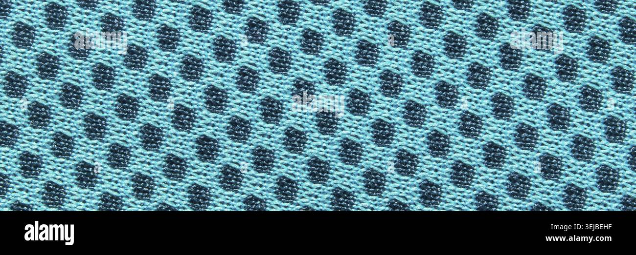 Motivo geometrico astratto in tessuto blu e nero con forme a diamante e superficie ruvida Foto Stock