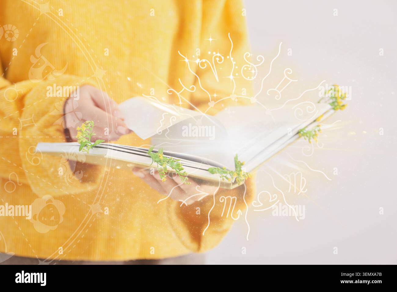Donna che legge un libro di astrologia con segni zodiacali sovrapposti, guida spirituale e previsione futura Foto Stock