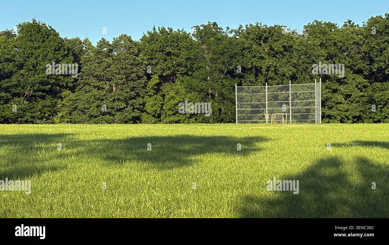 Un punto di ritrovo in un parco cittadino per softball o baseball Foto Stock