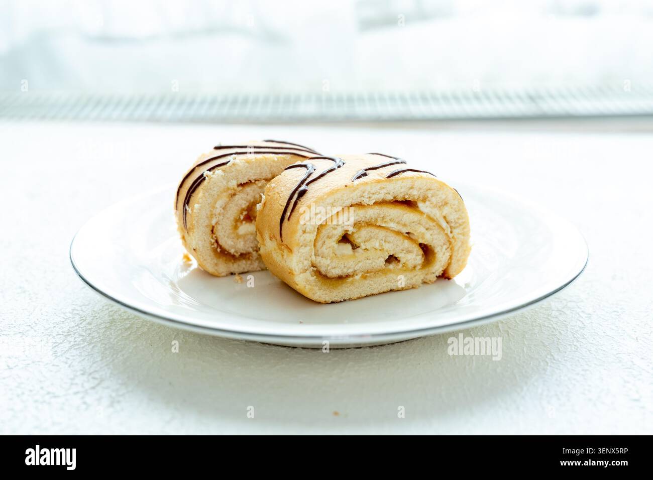Prima piano torta arrotolata alla banana Foto Stock