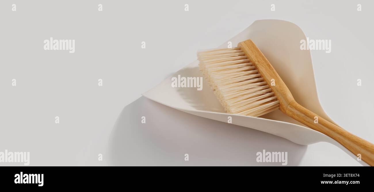 Set di pulizia per paletta e spazzola in legno per la pulizia di un ambiente domestico minimale Foto Stock