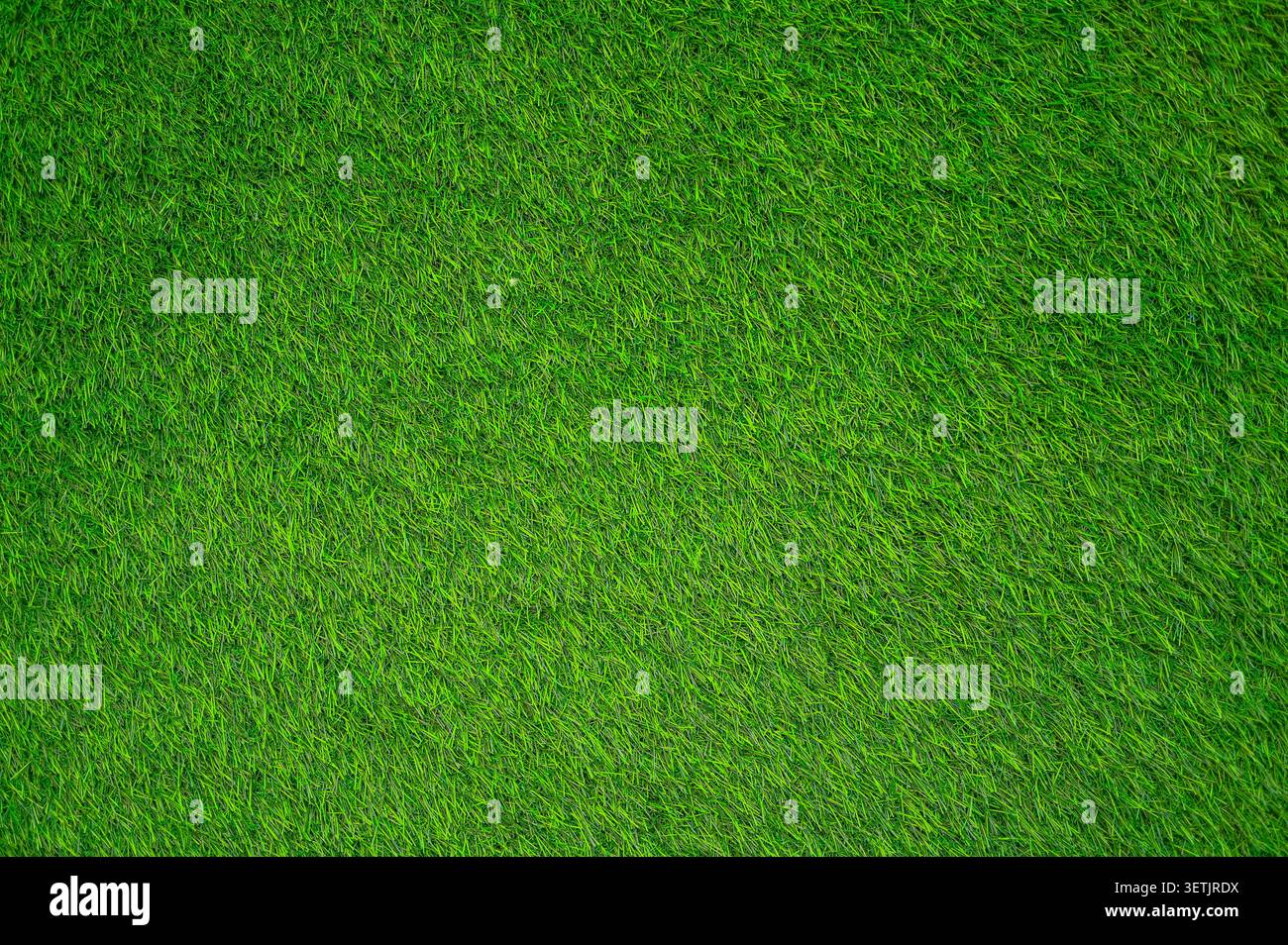 Erba sintetica verde come struttura o sfondo, campo erboso, vista dall'alto Foto Stock