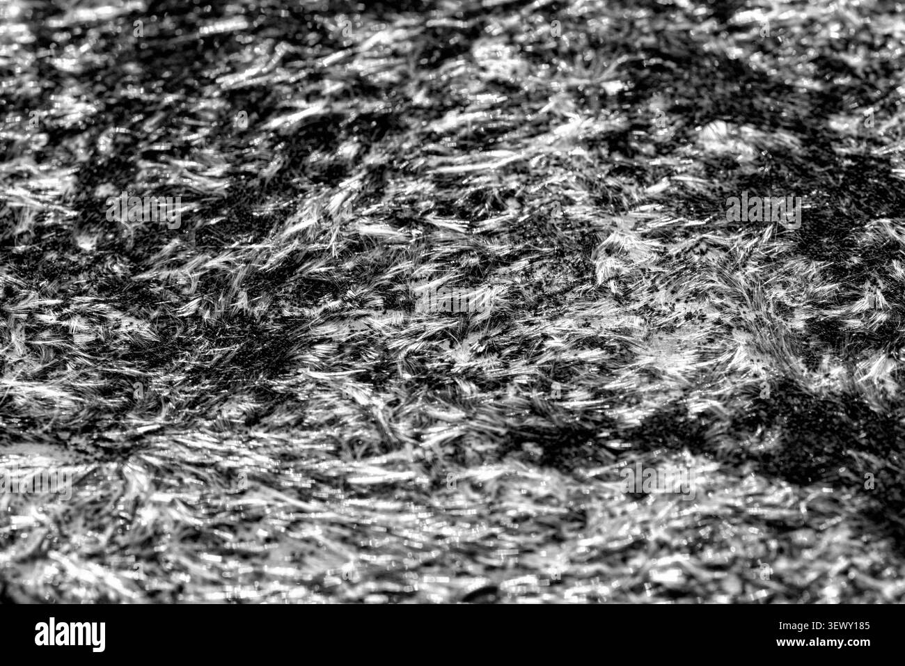 Vista dettagliata della texture vintage grintosa bianca e nera a grana elevata Foto Stock