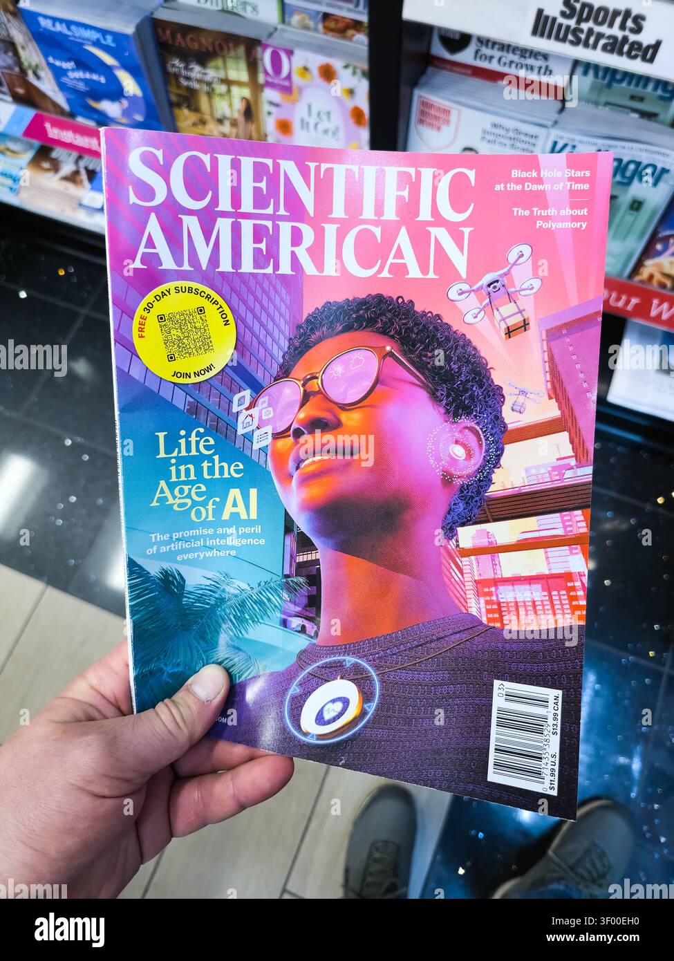 CHICAGO, il, USA - 20 GENNAIO 2026: A Hand tiene la rivista "Scientific American" con copertina a tema IA in una libreria. "Scientific American" i Foto Stock