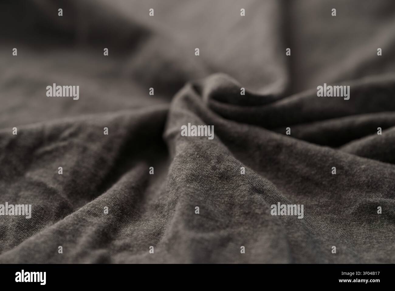 Foto ravvicinata di tessuto di cotone grigio per abbigliamento Foto Stock