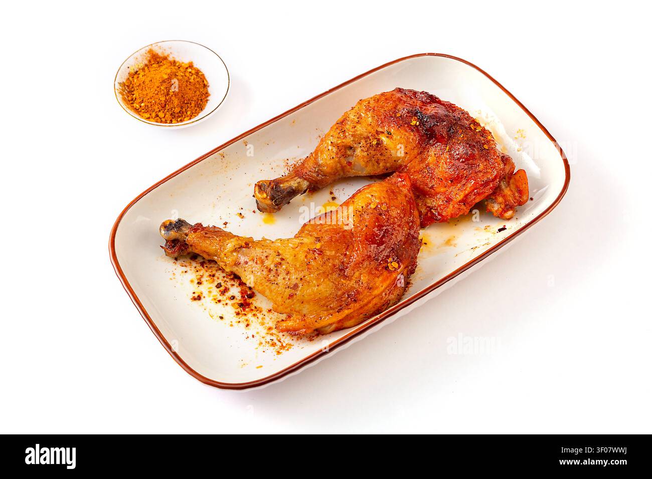 Cosce di pollo intere arrosto stile Orleans, quarto di pollame marinato dolce e piccante grigliato Foto Stock