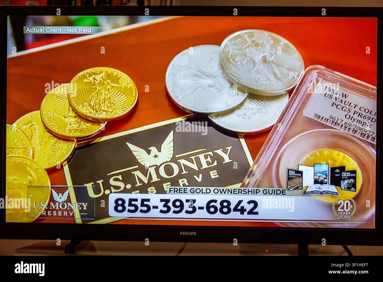Miami Beach Florida, televisione, monitor dello schermo, pubblicità commerciale, U.S. Money Reserve, monete d'oro, monete d'argento, metalli preziosi, lingotti d'oro, s Foto Stock