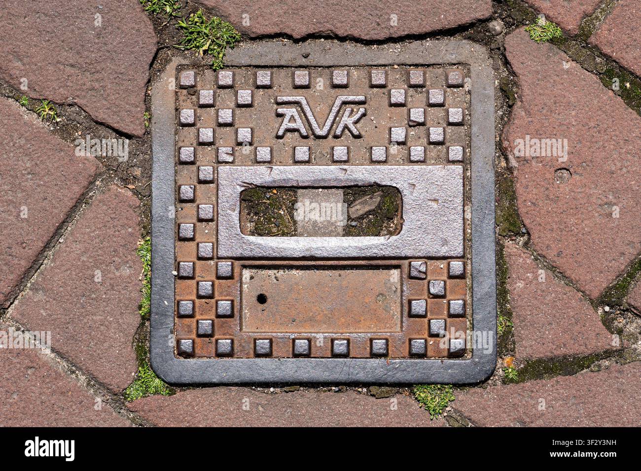 Copertura utilitaria AVK in ghisa Foto Stock