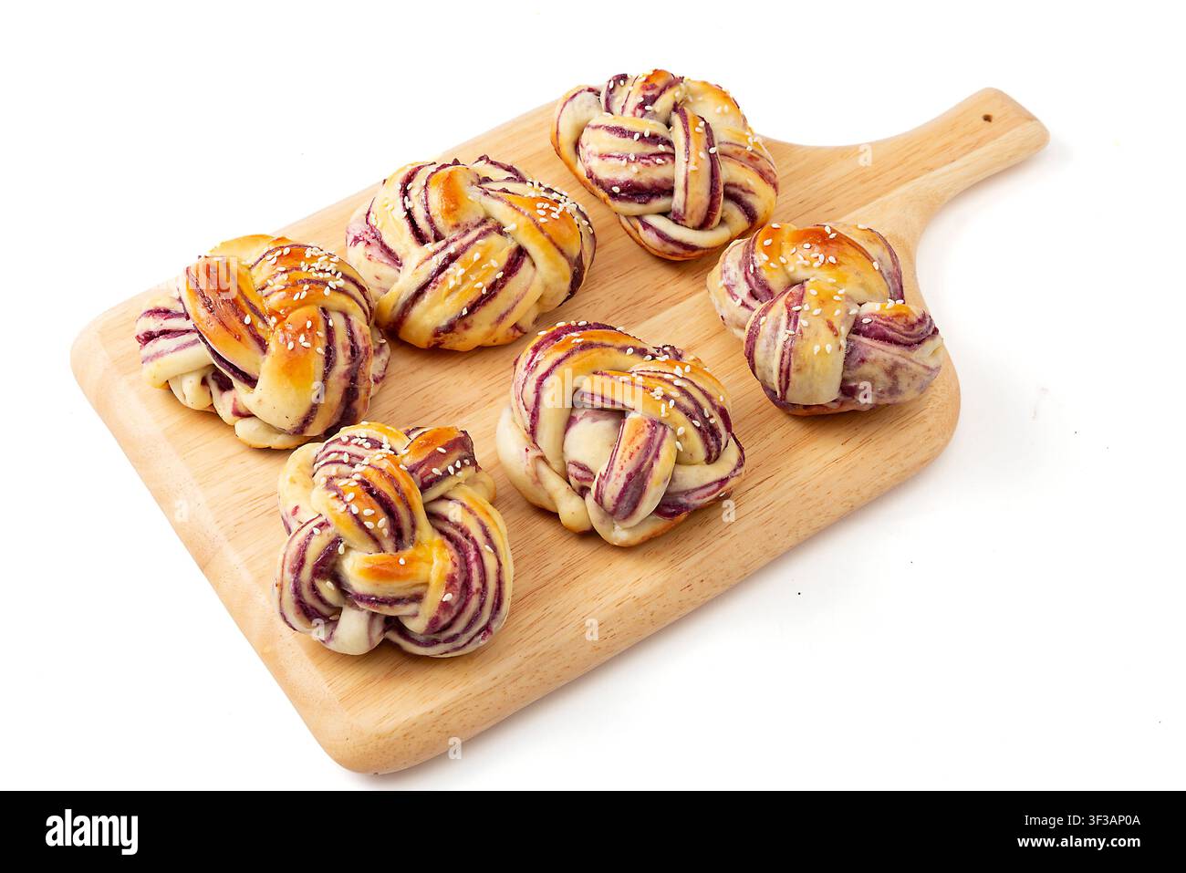 Mini pagnotte di toast alle patate dolci viola con crosta a vortice Foto Stock
