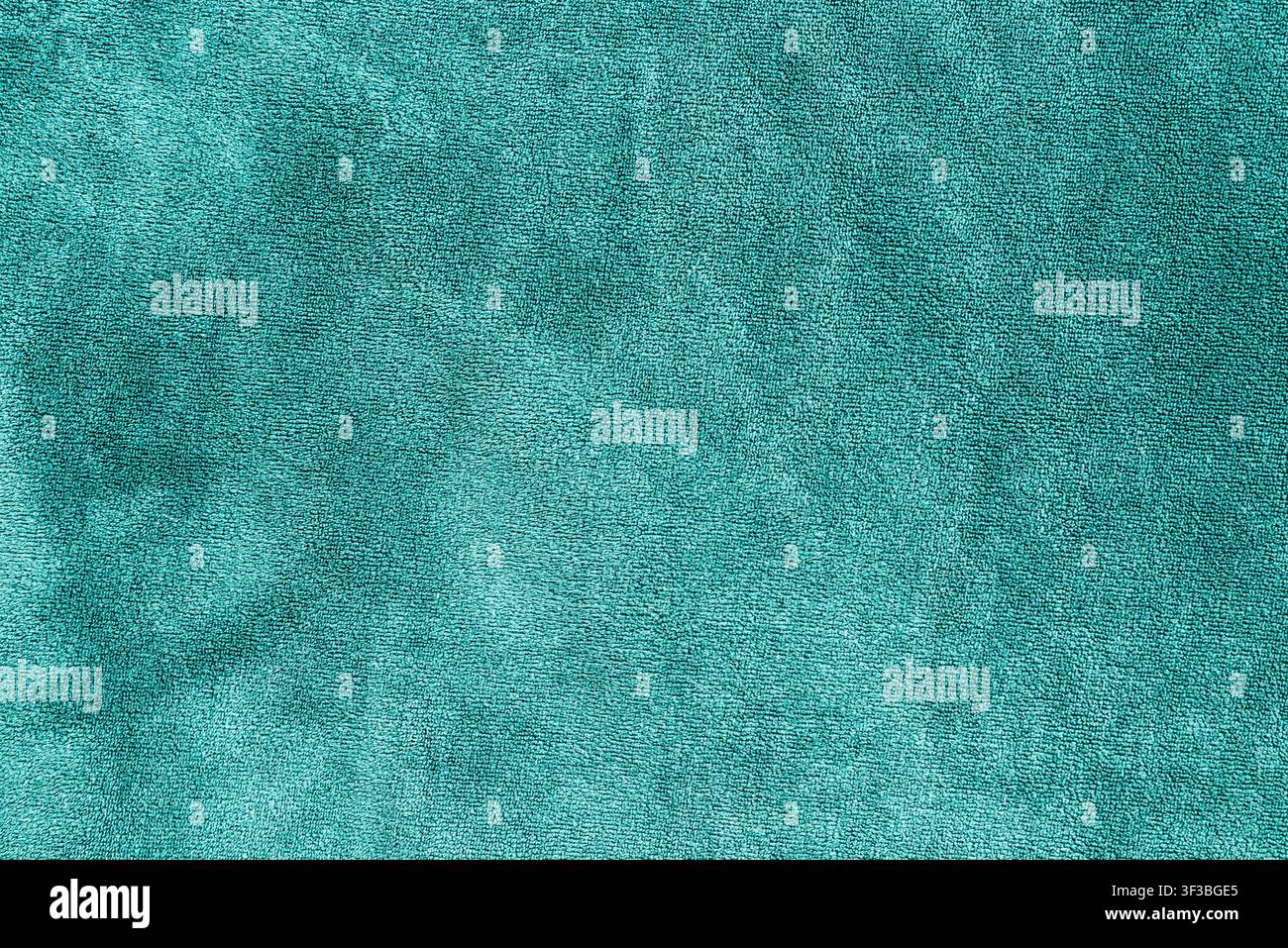 Sfondo in tessuto di spugna turchese vibrante con spazio per il testo. Sfondo in tessuto morbido ciano brillante con spazio per il testo. Foto Stock