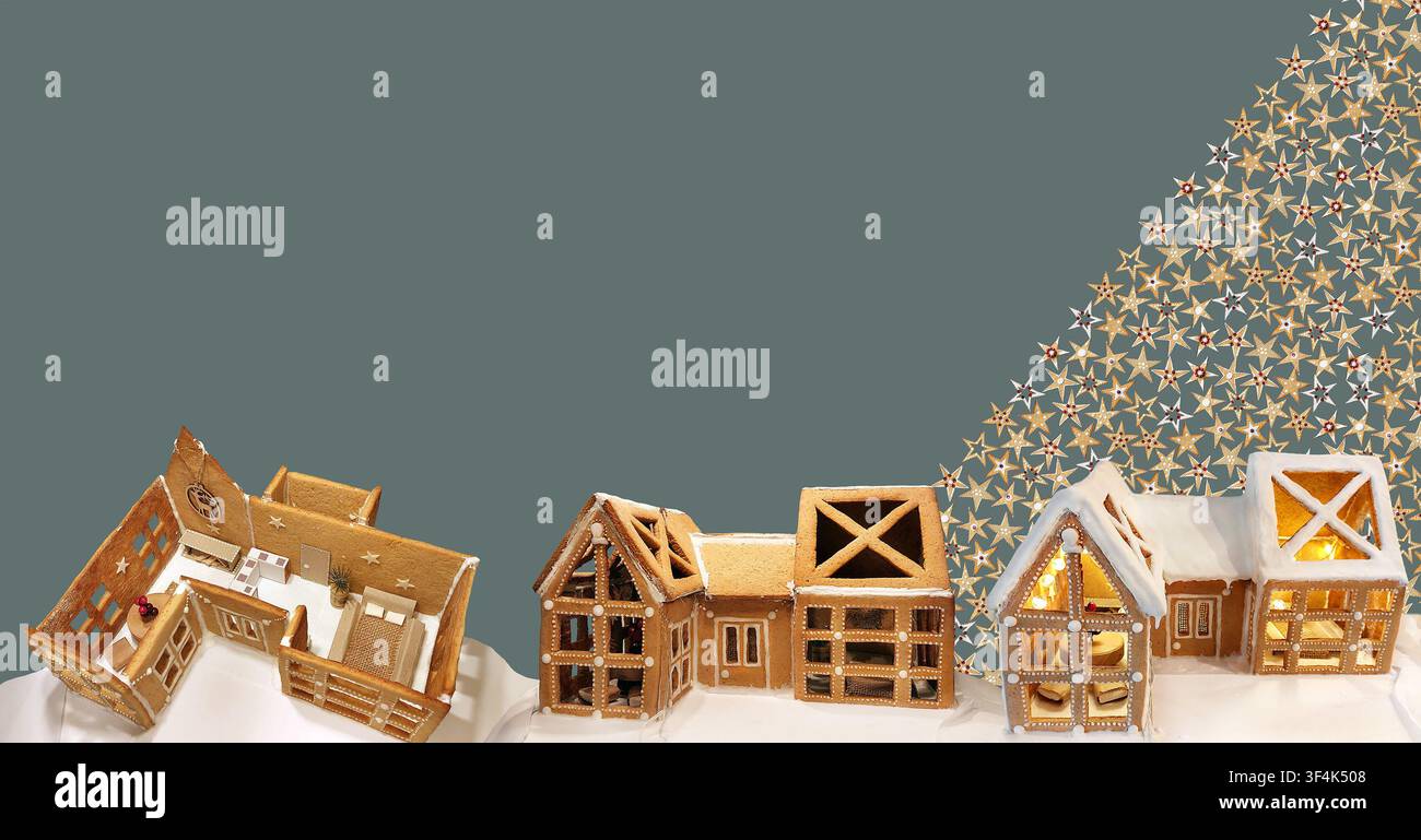 Concetto delle fasi di costruzione della casa di pan di zenzero natalizio. Tre case in miniatura dal telaio all'edificio completamente decorato, sfondo a motivi di biscotti a stella Foto Stock