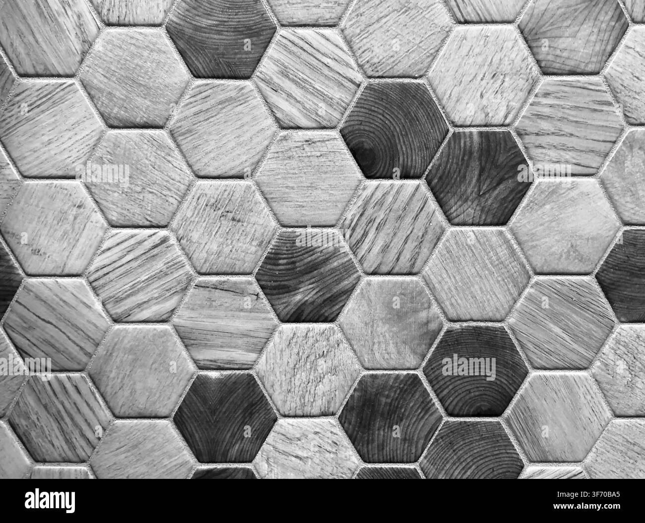 Mosaico geometrico esagonale con texture di venatura del legno naturale Foto Stock