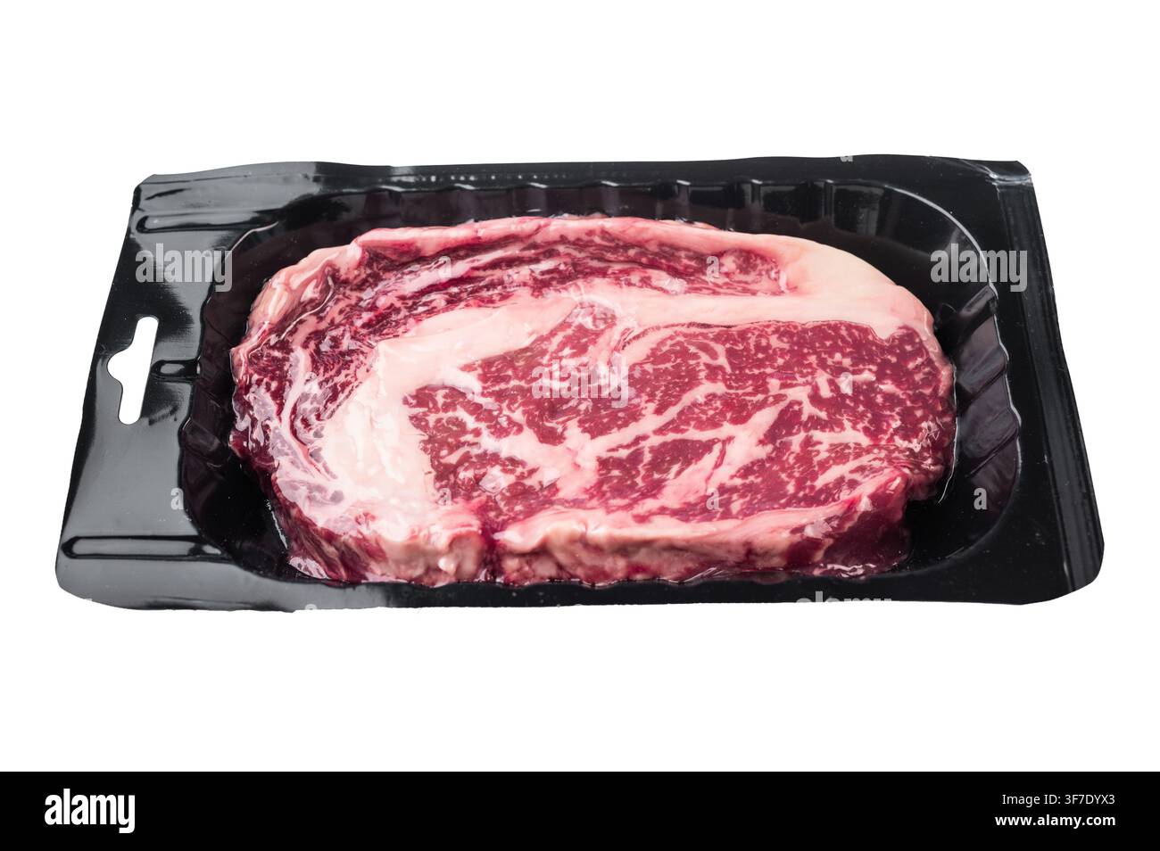 Bistecca cruda di riso nota anche come filetto di scotch entrecote o delmonico. Costolette di manzo marmorizzate isolate su sfondo bianco Foto Stock