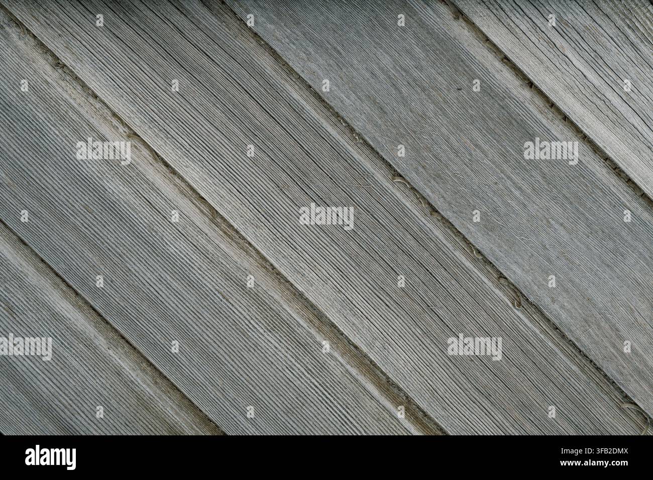 Vecchie assi di legno diagonali naturali con sfondo texture, colore grigio Foto Stock