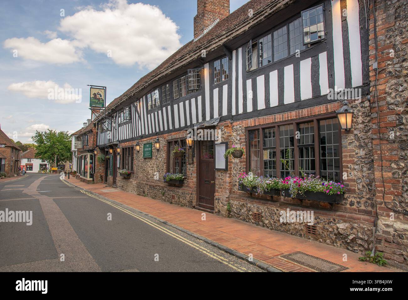 Il storico pub George Inn, villaggio di Alfriston, East Sussex, Inghilterra. Foto Stock