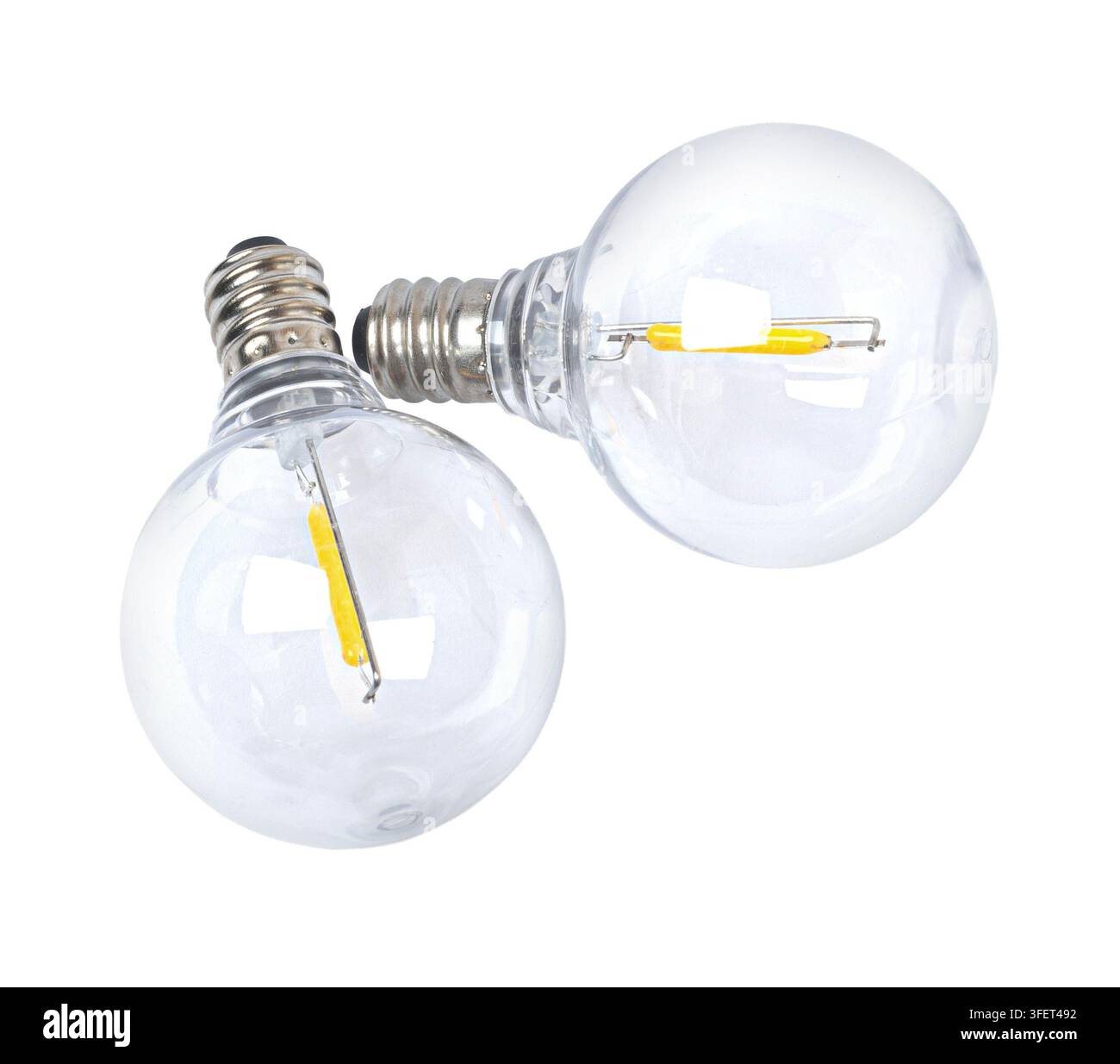 Lampadine a filamento LED in vetro trasparente che mostrano innovazione ed efficienza energetica Foto Stock
