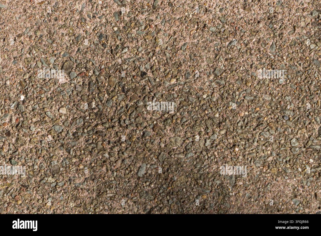Struttura di pietra ruvida con piccoli ciottoli e superficie naturale Foto Stock
