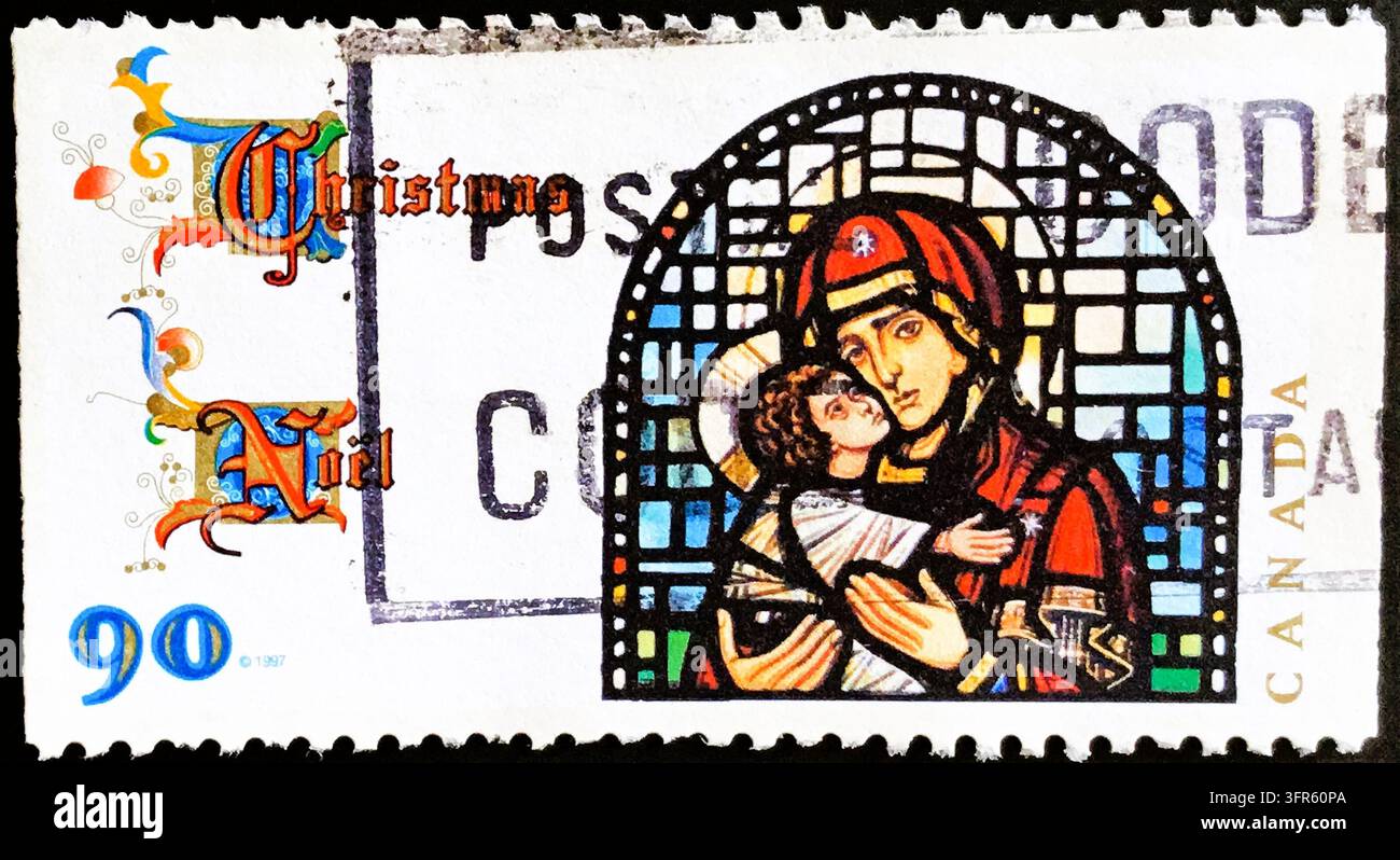 Francobollo canadese del 1997 raffigurante una finestra con vetrata raffigurante Madonna e Bambino, Edizione Natalizia Noël, Valore nominale di 90 centesimi, Condizione usata Foto Stock