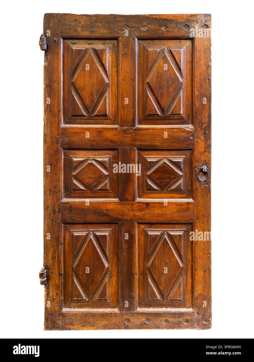 Porta interna singola rustica e storica in legno massello di noce, con sei pannelli in rilievo a forma di rombo o losanga splendidamente realizzati. Autentica Foto Stock