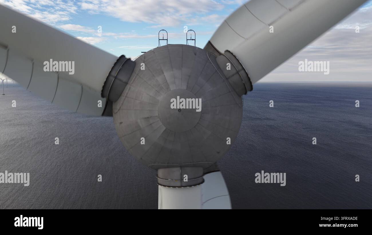 Le pale delle turbine eoliche offshore ruotano generando energia sostenibile Foto Stock