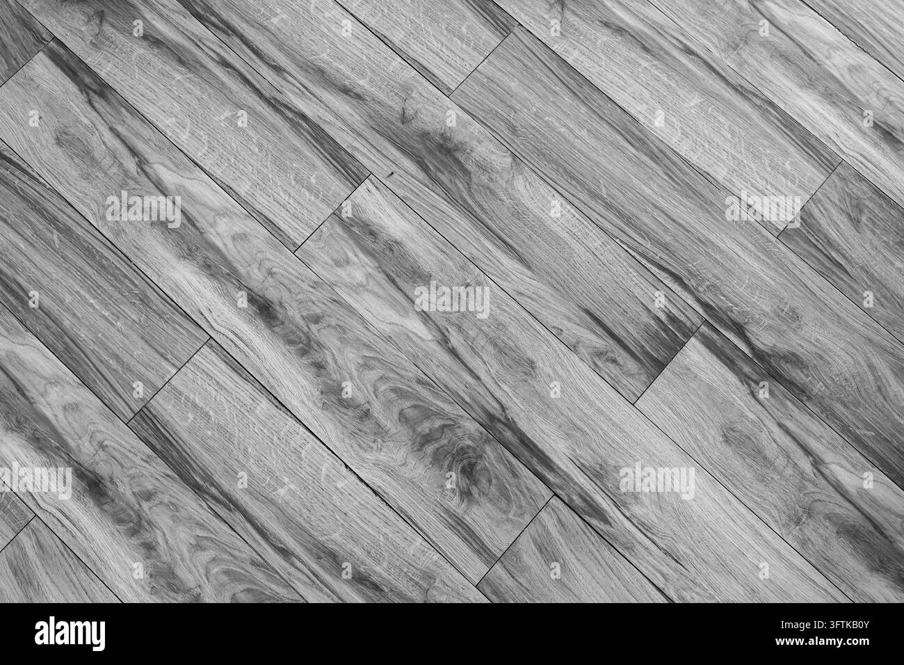 Un pavimento in legno grigio con venatura realistica, disposizione diagonale delle assi e texture superficiale interna senza giunzioni che crea uno sfondo architettonico neutro Foto Stock