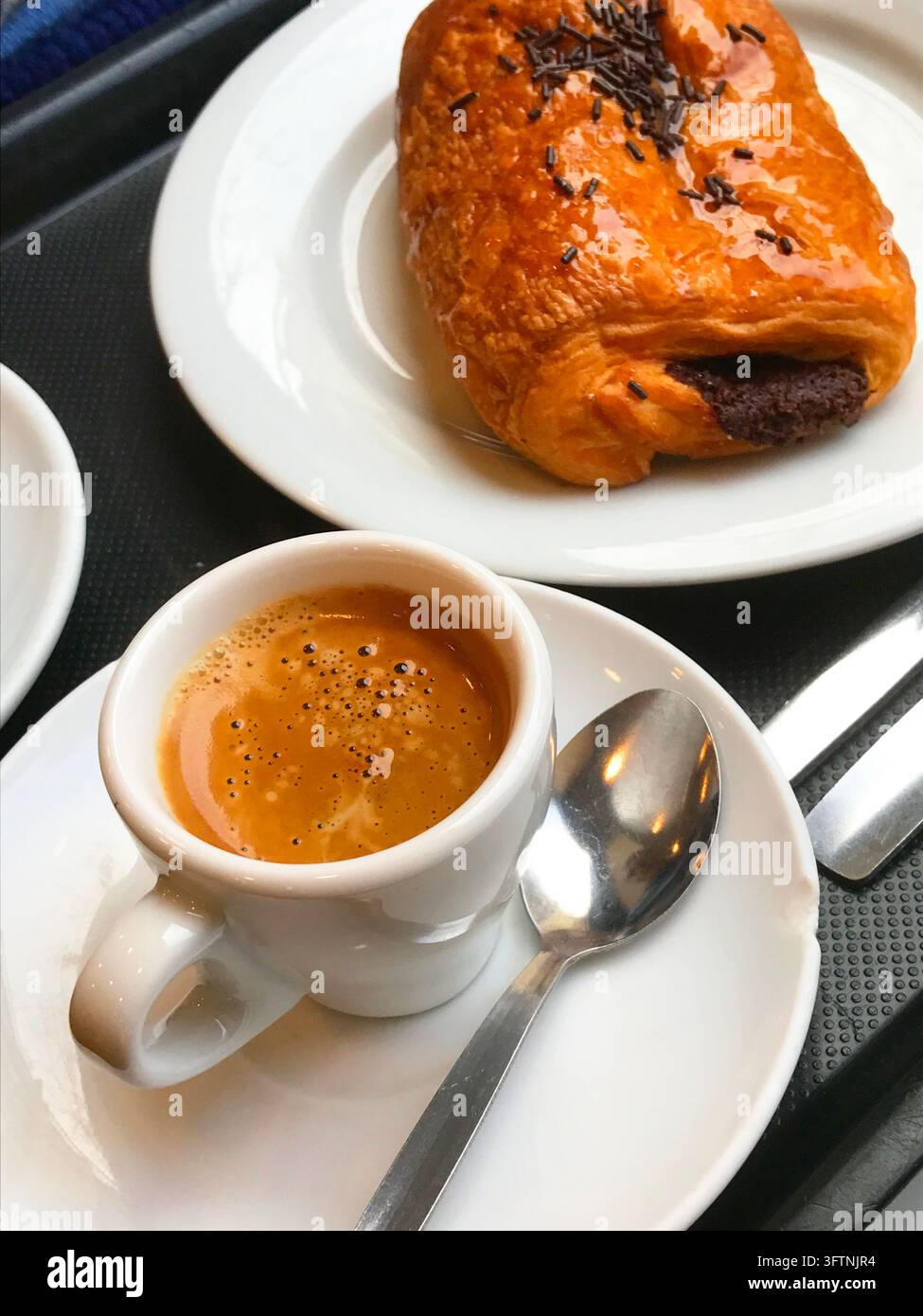 Tazza di caffè e napolitana. Foto Stock