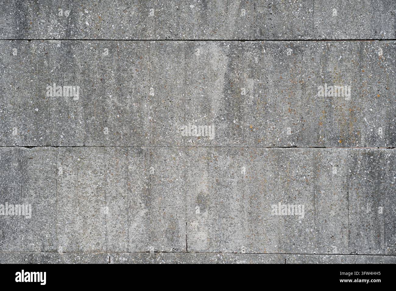 Sfondo texture di muro in blocchi di cemento grigio. Motivo senza cuciture di muratura architettonica in mattoni di cemento. Texture solida di blocchi di calcestruzzo per l'edilizia ind Foto Stock
