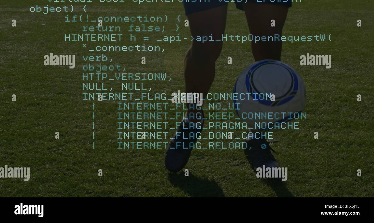 Gambe di una giocatrice in piedi che tiene il pallone da calcio in campo con pantaloncini, calzini al ginocchio e tacchetti con sovrapposizione di codice Foto Stock