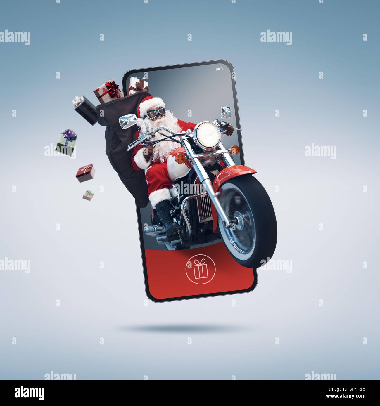 Babbo Natale non convenzionale in sella a una moto e uscendo da uno schermo dello smartphone, Natale e concetto tecnologico Foto Stock
