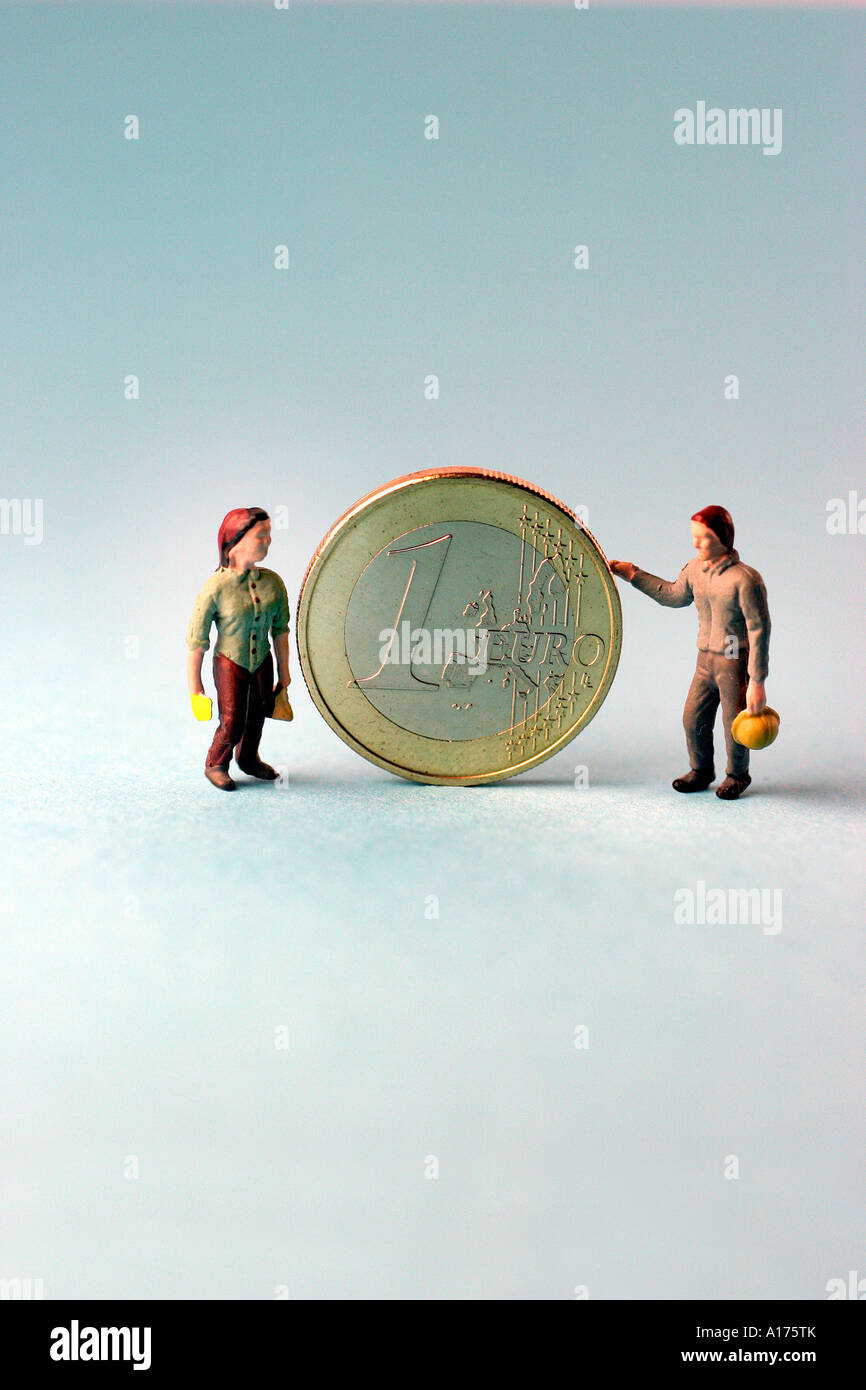 Figure e una moneta da un euro Foto Stock