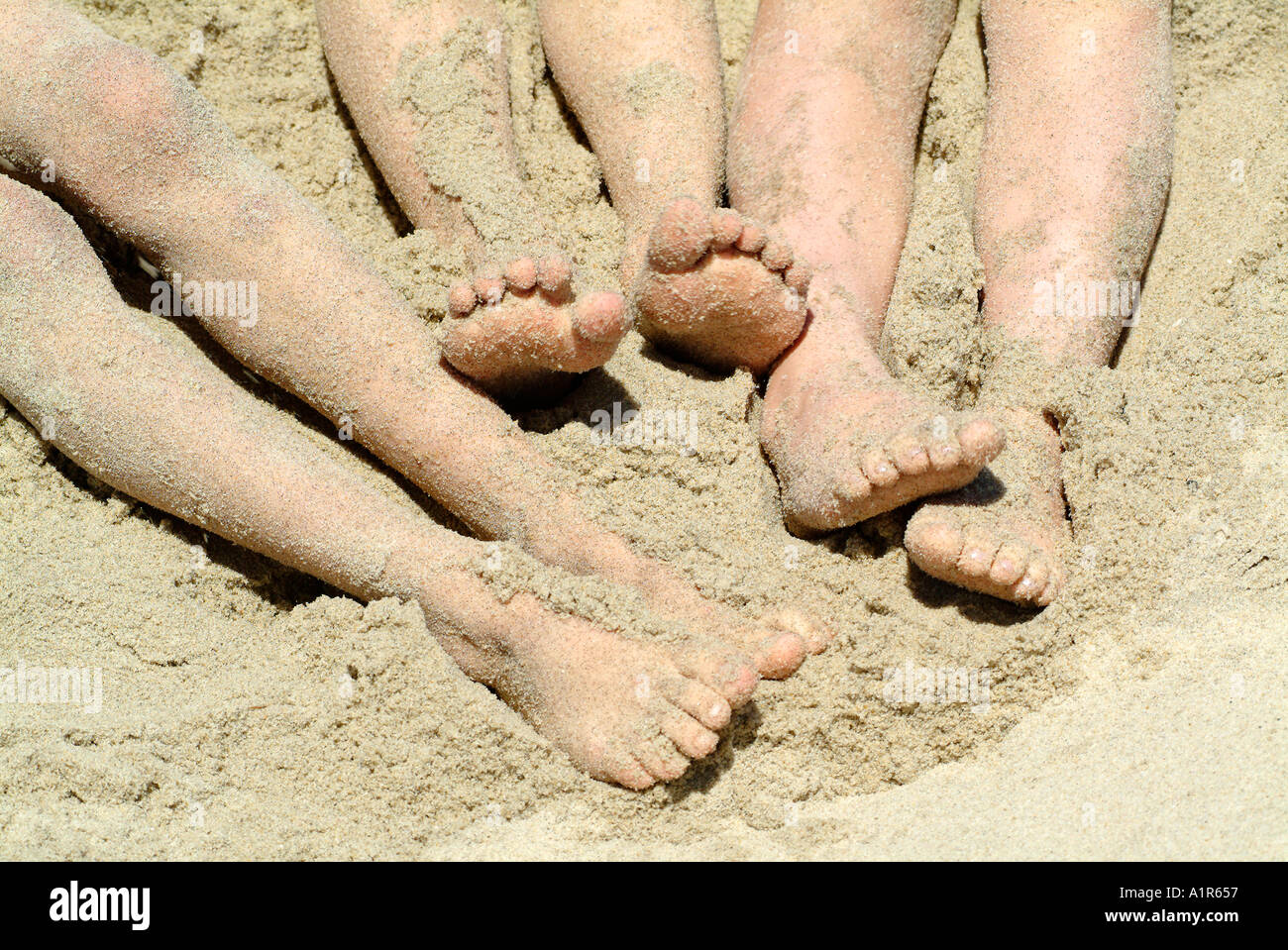 I piedi nella sabbia Foto Stock