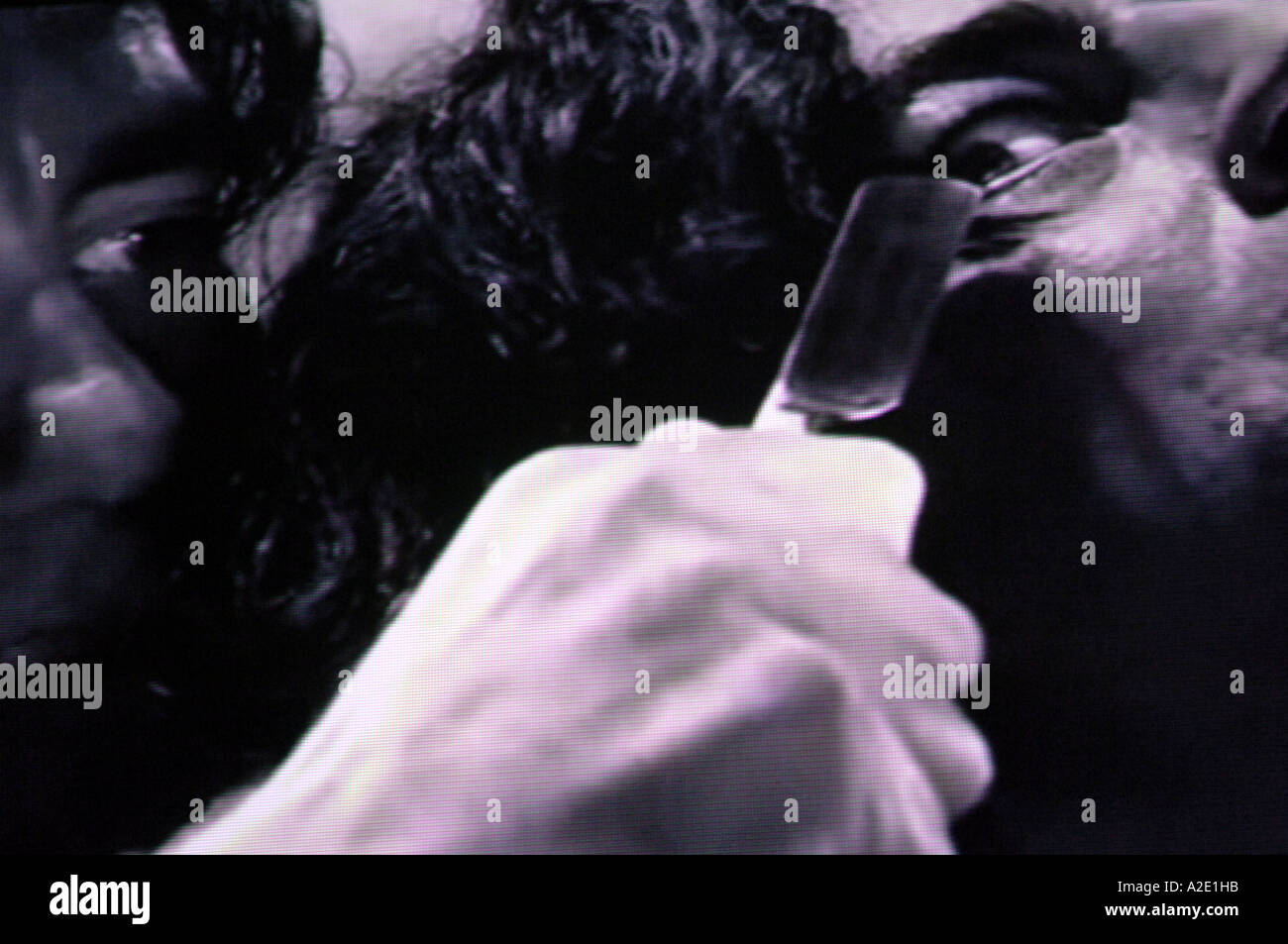 Dwight minaccia jackie boy Rafferty con un rasoio spietato Sin City Frank Miller film Foto Stock