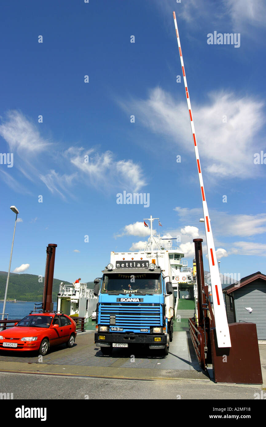 Cars driving off ferry Foto Stock