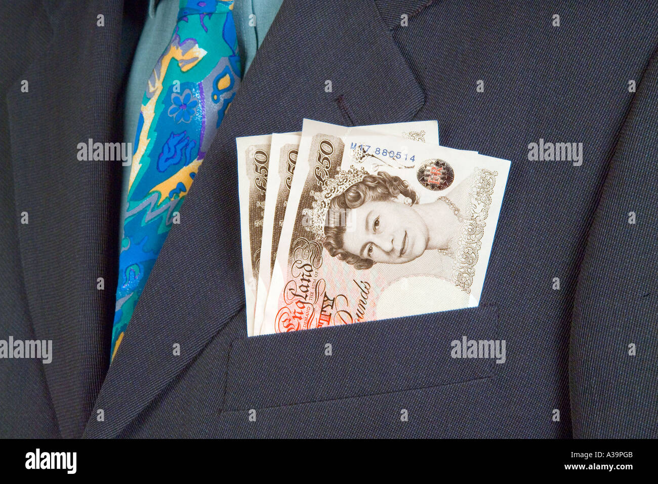 £50 cinquanta pound notes in business mans suit pocket Foto Stock