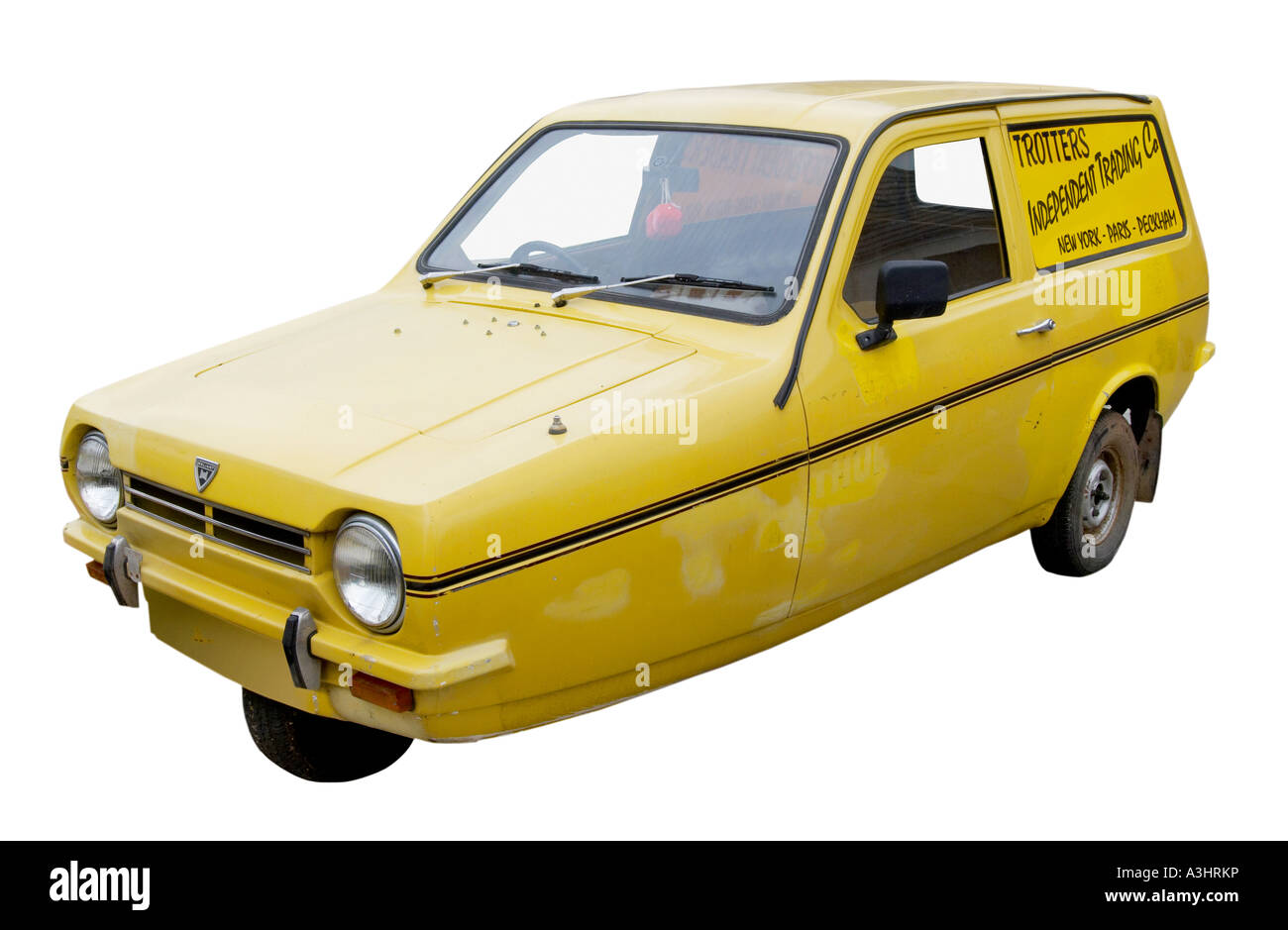 Il furgone giallo Reliant Robin di del Boy con la Trotters Independent Trading Co decorata sul suo fianco. Come usato nella serie televisiva Only Fools and Horses. Foto Stock