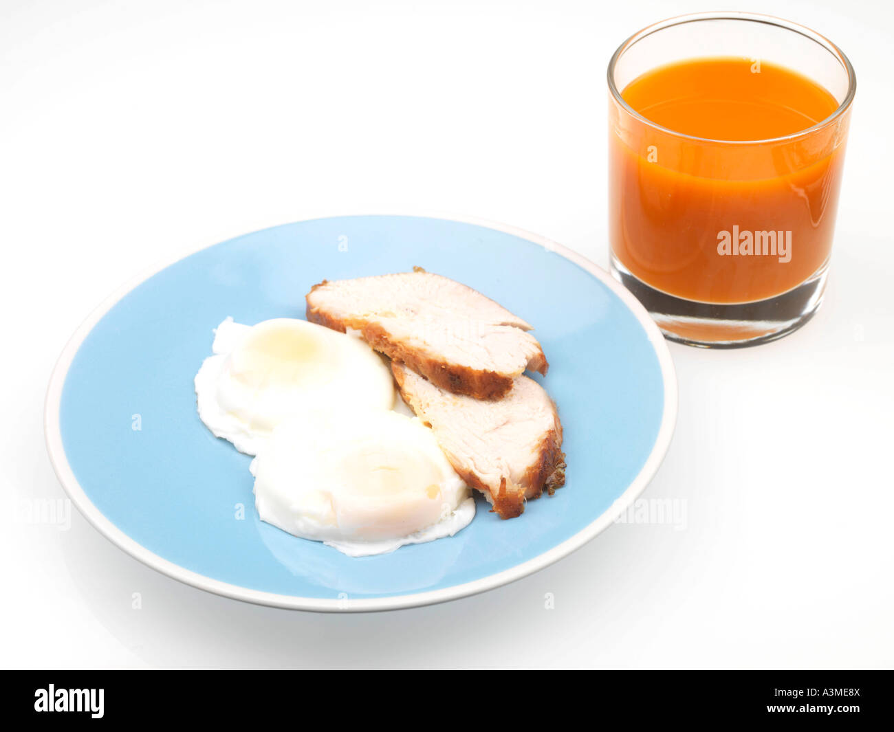 La Turchia con le uova in camicia e succo di carota Foto Stock