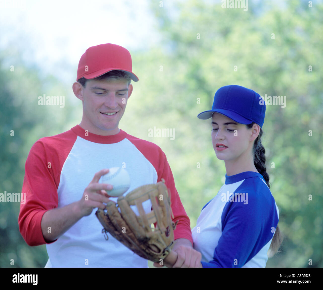 L uomo e la donna i giocatori di baseball Foto Stock