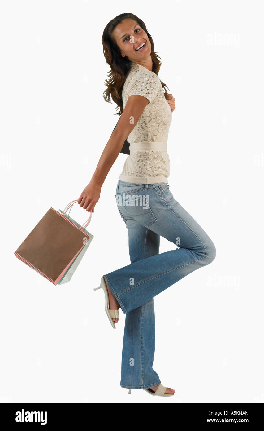Studio shot di donna con azienda shopping bag Foto Stock