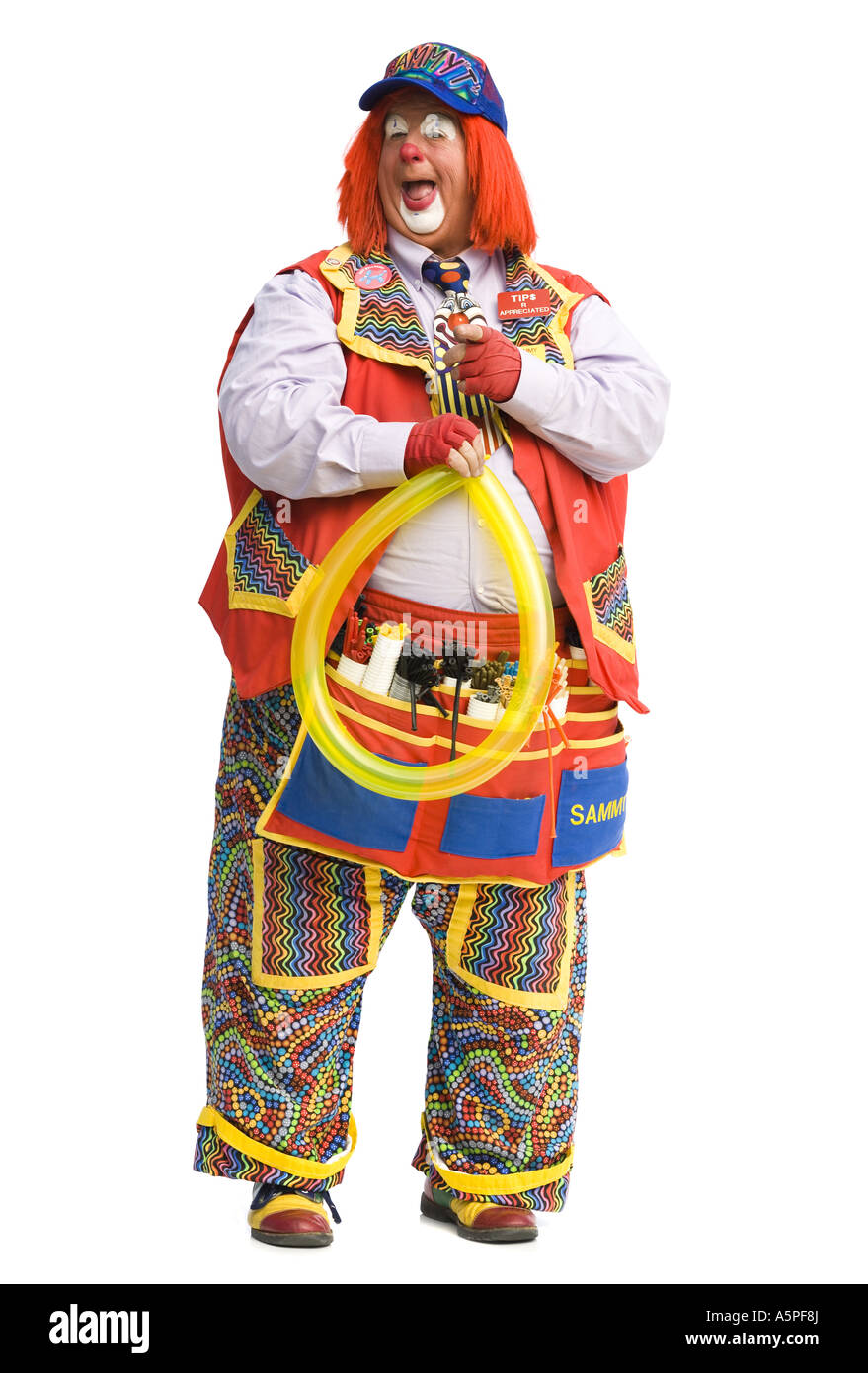 Clown con palloncino giallo Foto Stock