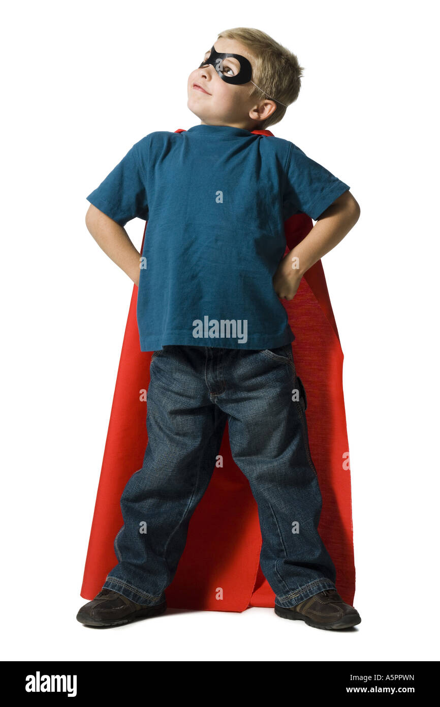 Giovane ragazzo in costume da supereroe Foto Stock