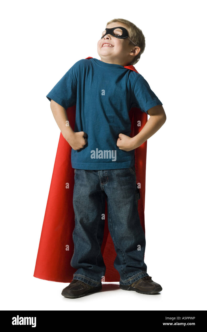 Giovane ragazzo in costume da supereroe Foto Stock