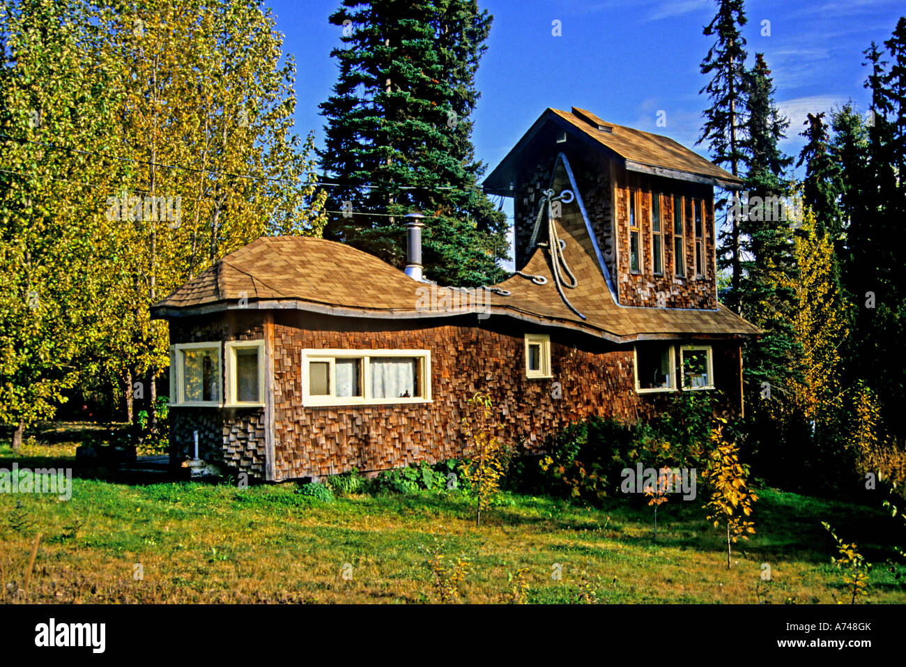 Un'immagine orizzontale di una casa costruita per assomigliare ad un boot. Foto Stock