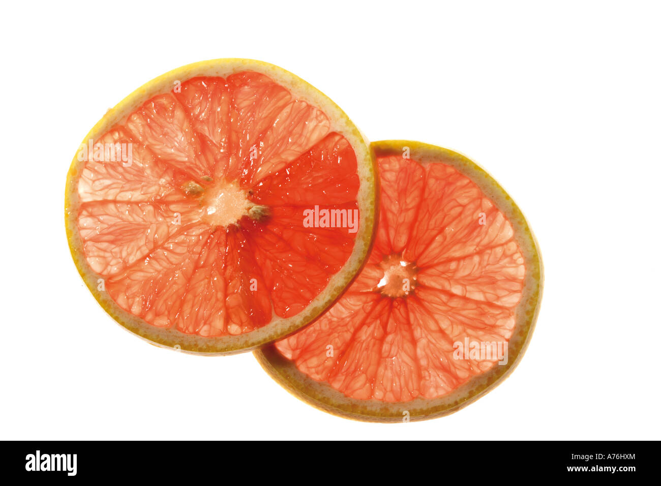 Due fette di pompelmo rosso rubino Foto Stock