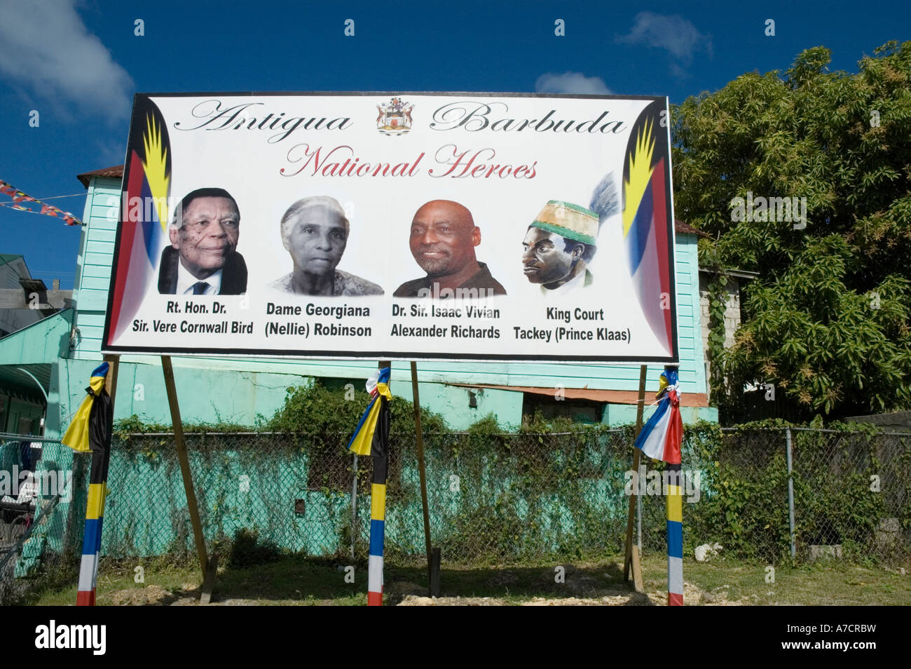 Un grande cartellone raffiguranti ritratti di quattro eroi nazionali di Antigua e Barbuda, St John's, Antigua Foto Stock