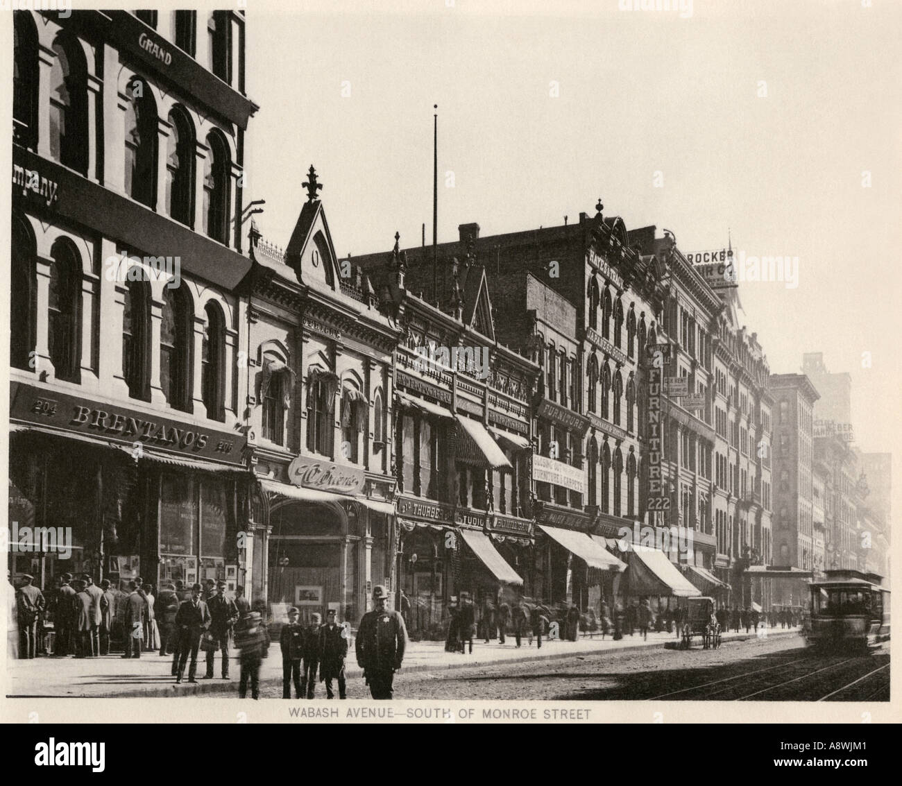 Bretanos Bookstore e altri negozi di vendita al dettaglio su Wabash Avenue a Sud di Monroe Street Chicago 1890s. Helios Foto Stock